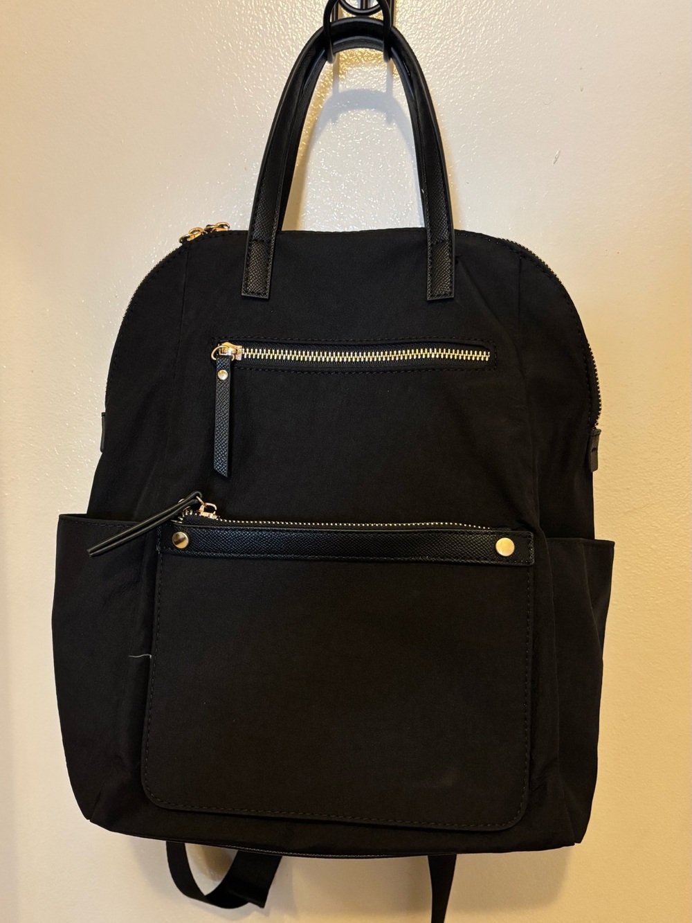 Madison West Black Backpack w/White Vertical Stripes Interior. Multiple Pockets.